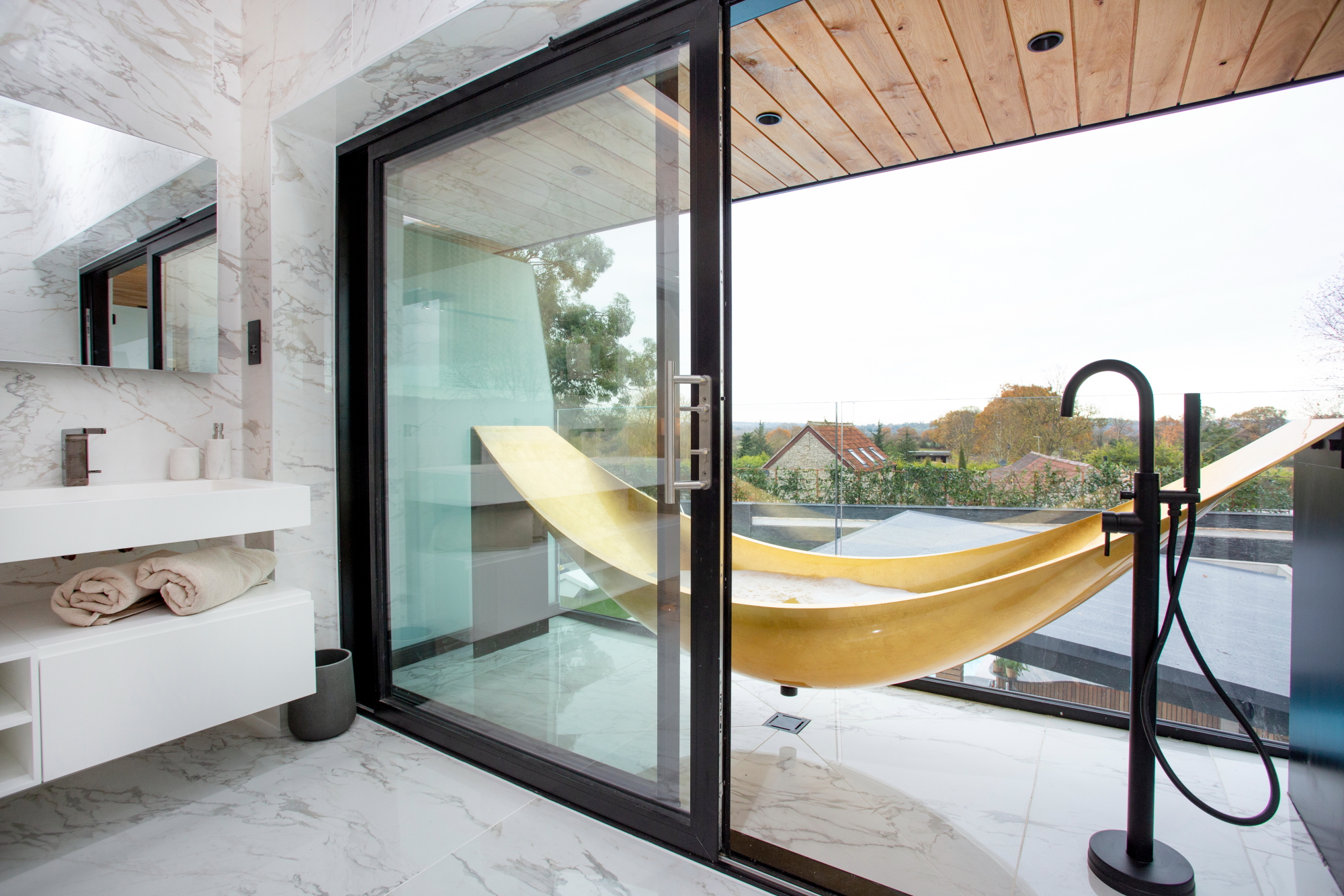 Hammock Bath through sliding doors on balcony