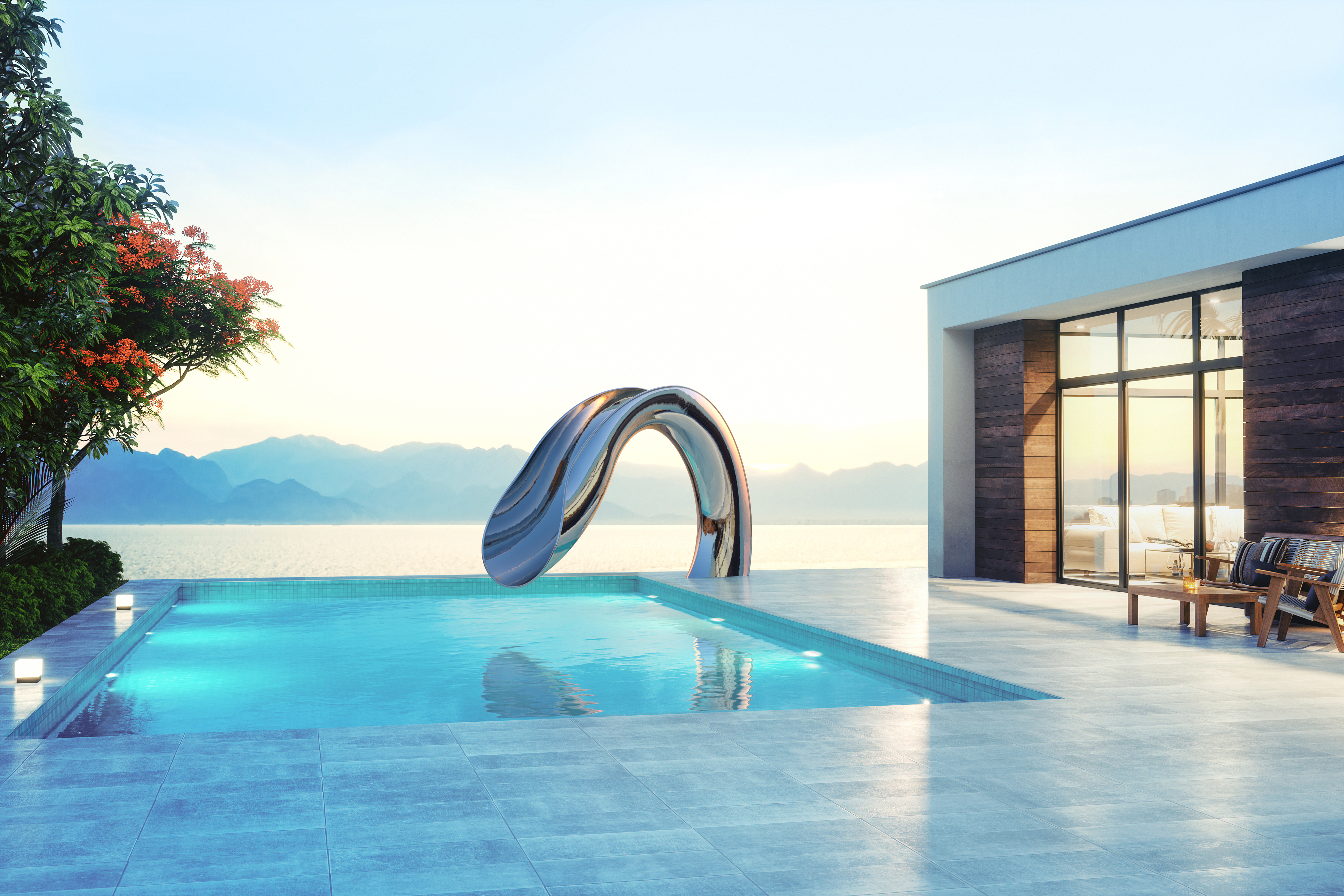 Custom water slide with metallic finish at sunset.