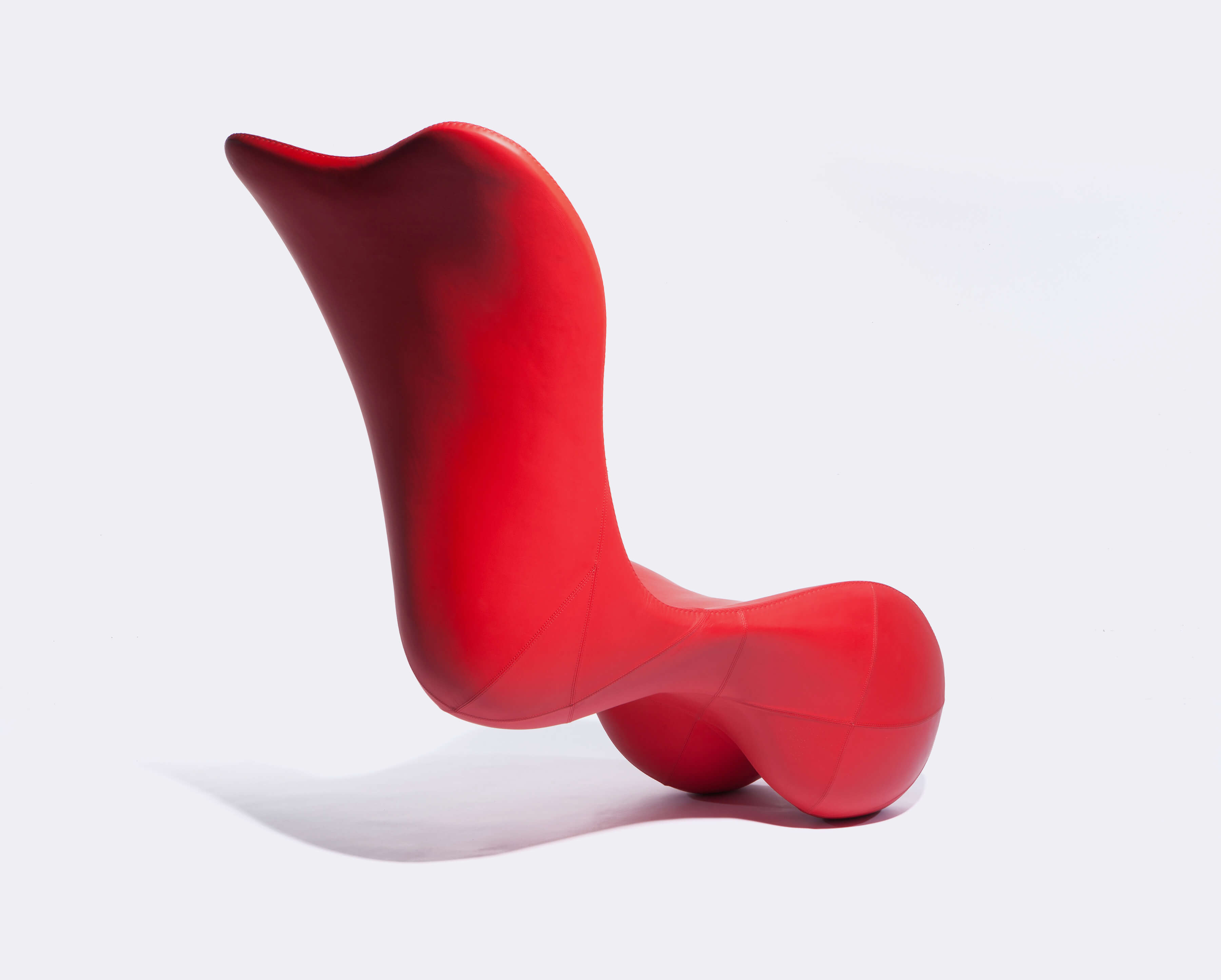 Bodice Rocker, contemporary lounge chair in custom red leather by Splinterworks.