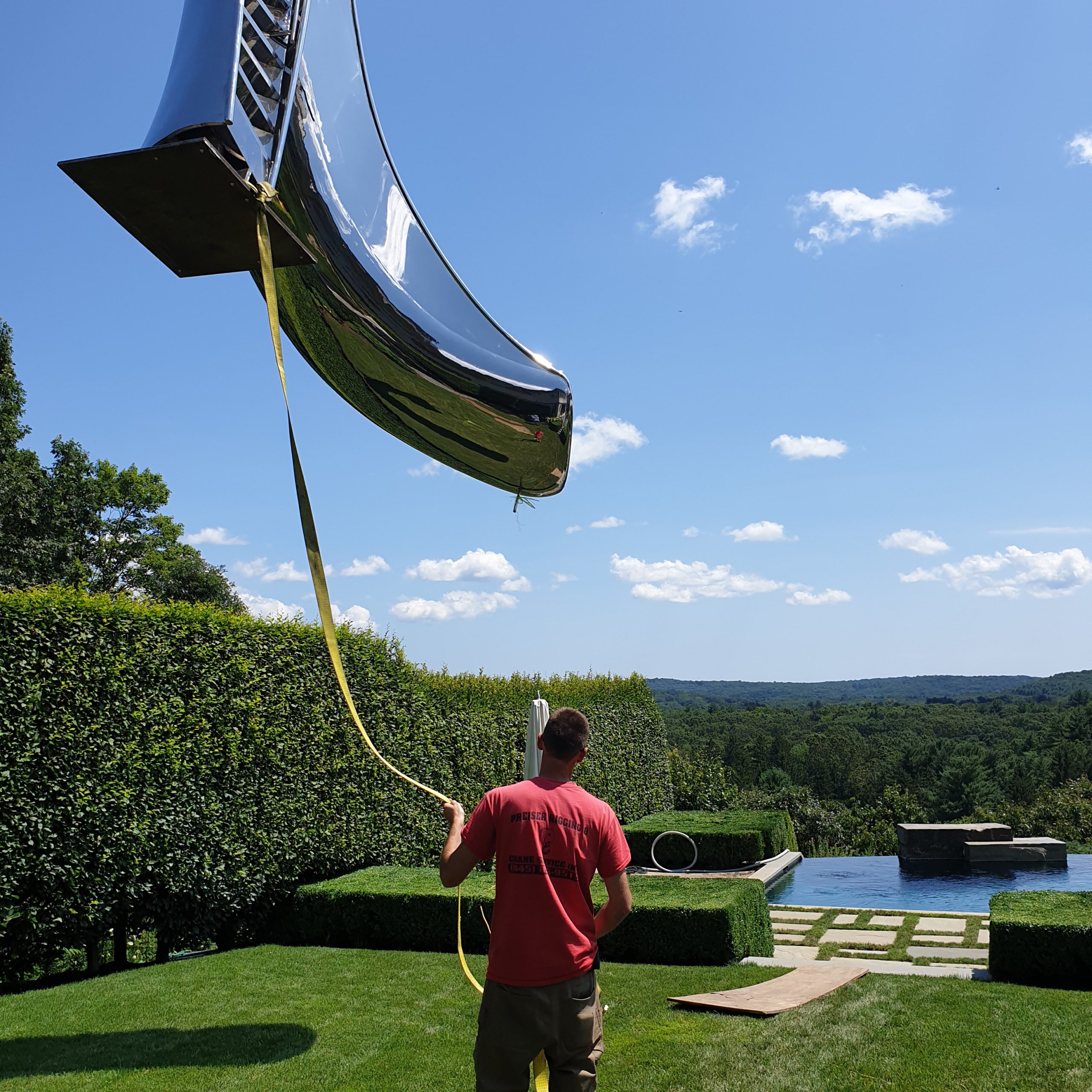 Installation of swimming pool slide for outdoor pool