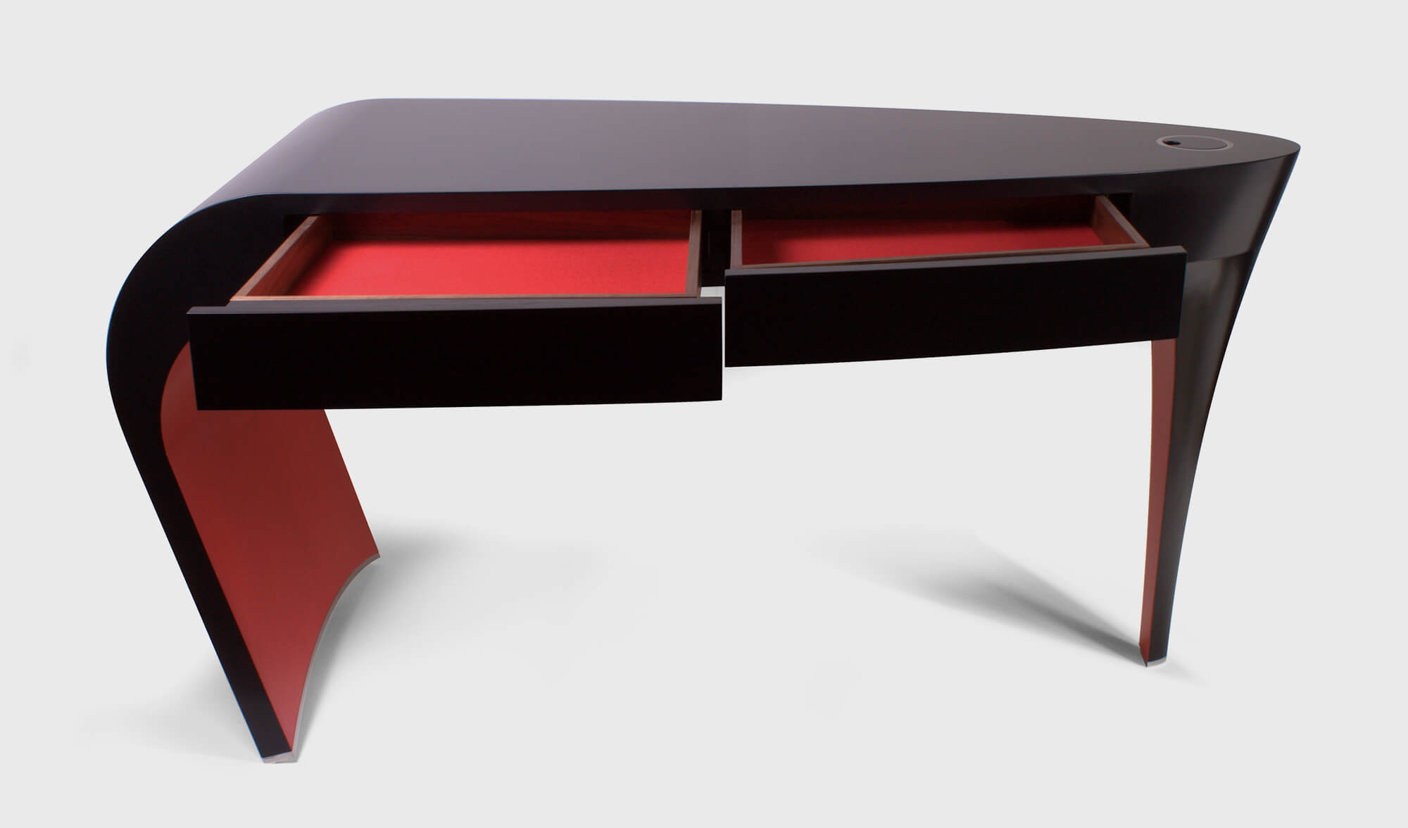 Black lacquer dressing table with red detail is an heirloom of the future.