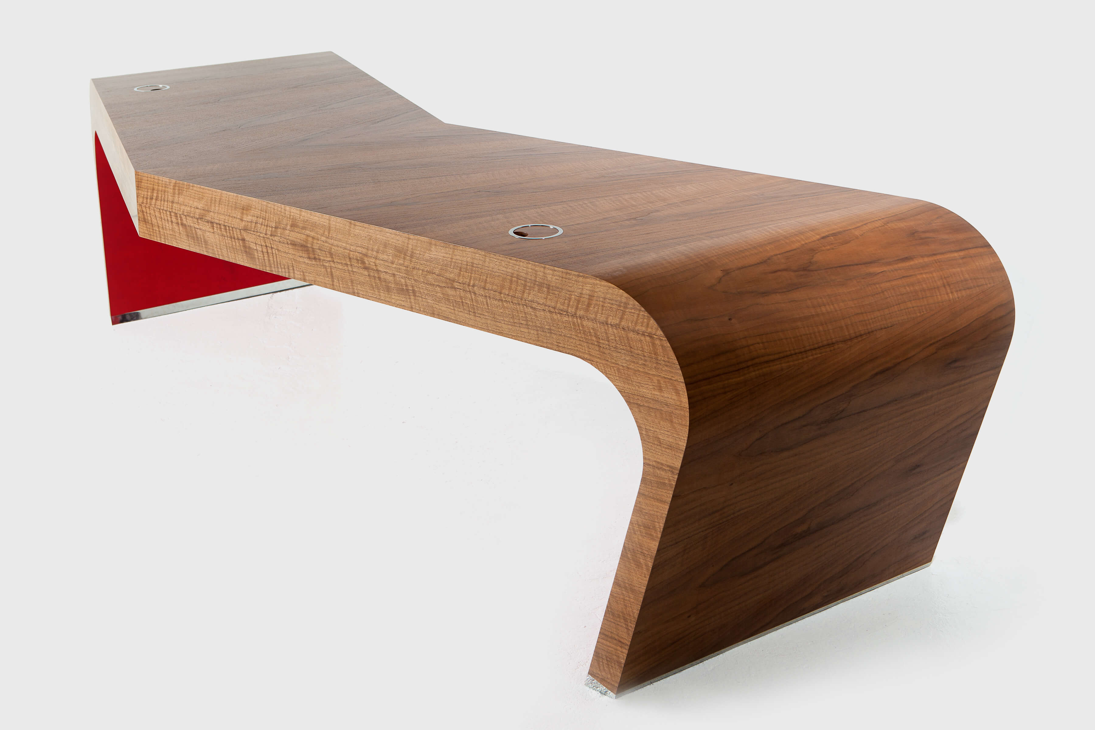 Large v-shaped desk with dramatic red detail hand-crafted by Splinterworks