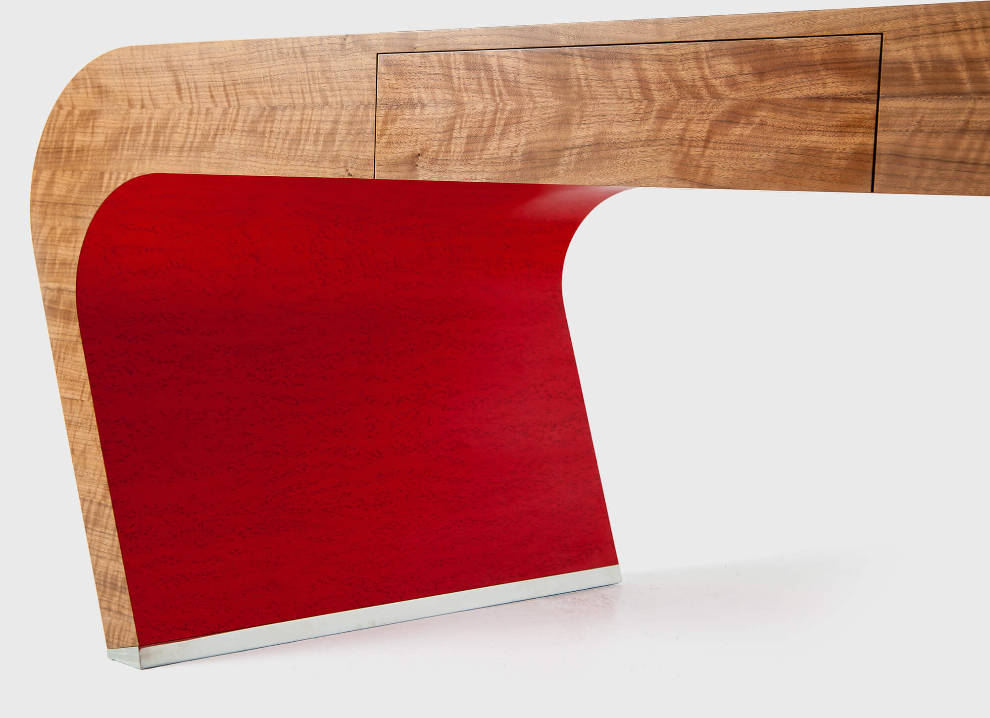 Custom made luxury desk with red and metal detail by Splinterworks