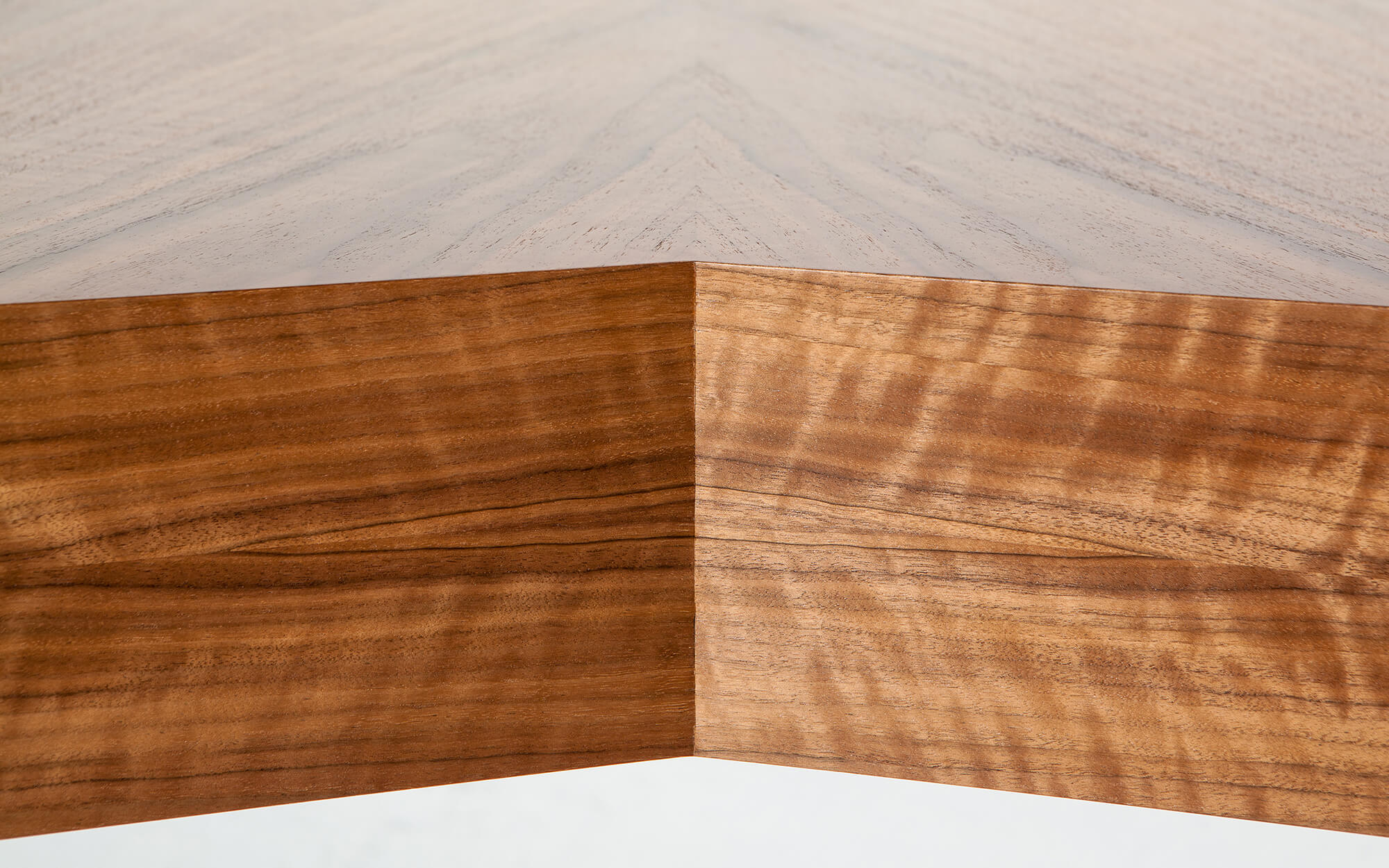 Detail of book matched veneers on custom made v-shaped desk