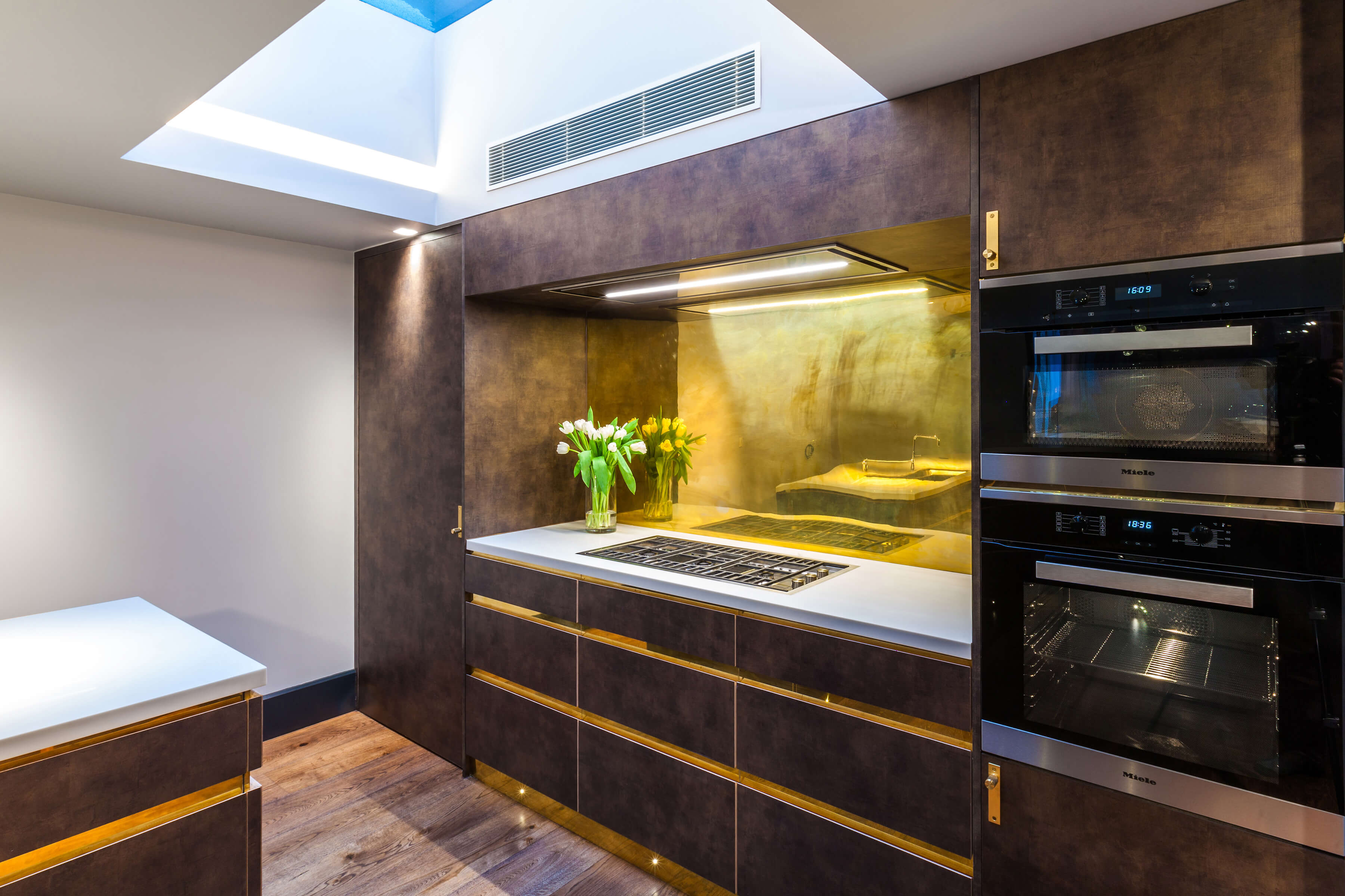 Skylight in luxurious kitchen with tactile cabinets