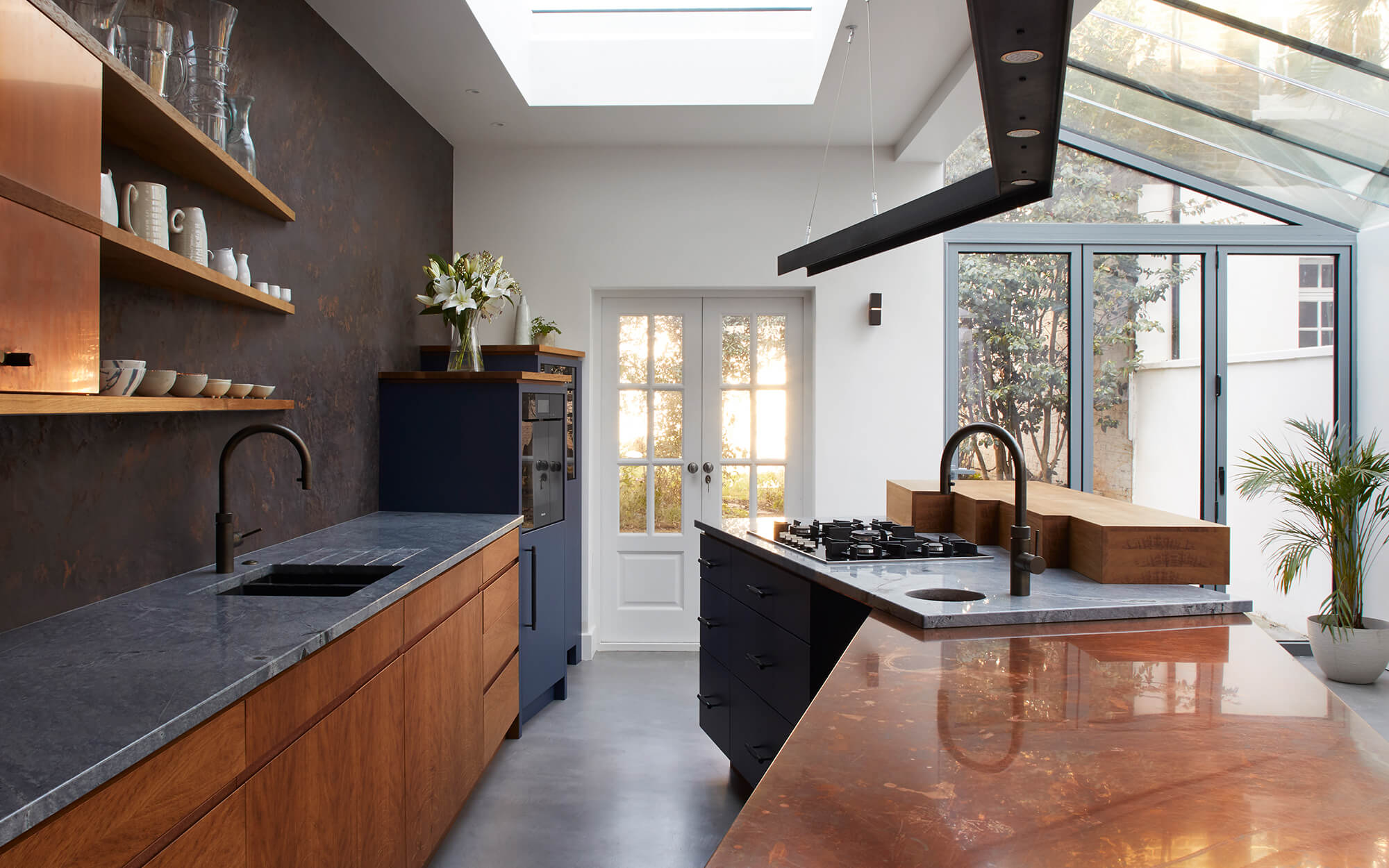 A fun ergonomic kitchen with concrete and copper work surfaces