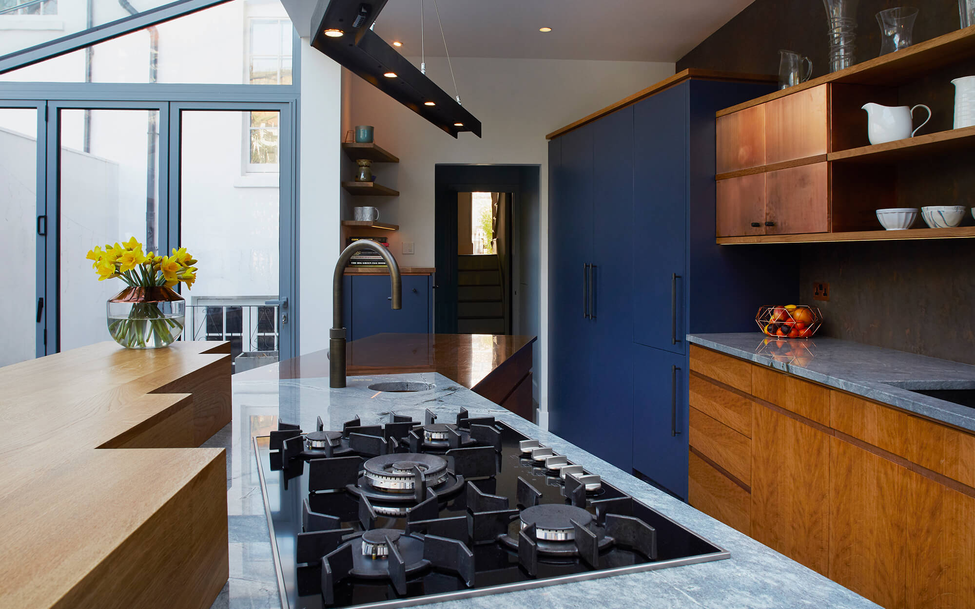A fun ergonomic family kitchen with concrete counter tops by Splinterworks