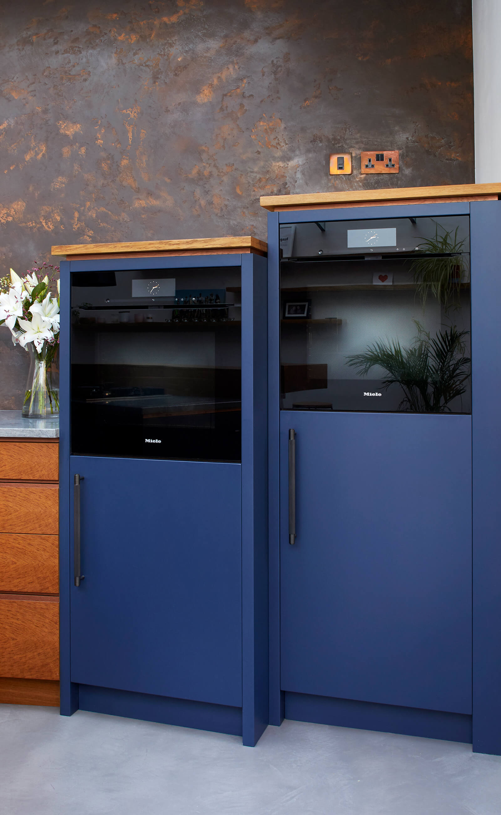 Blue cabinets in fun family kitchen designed by Splinterworks