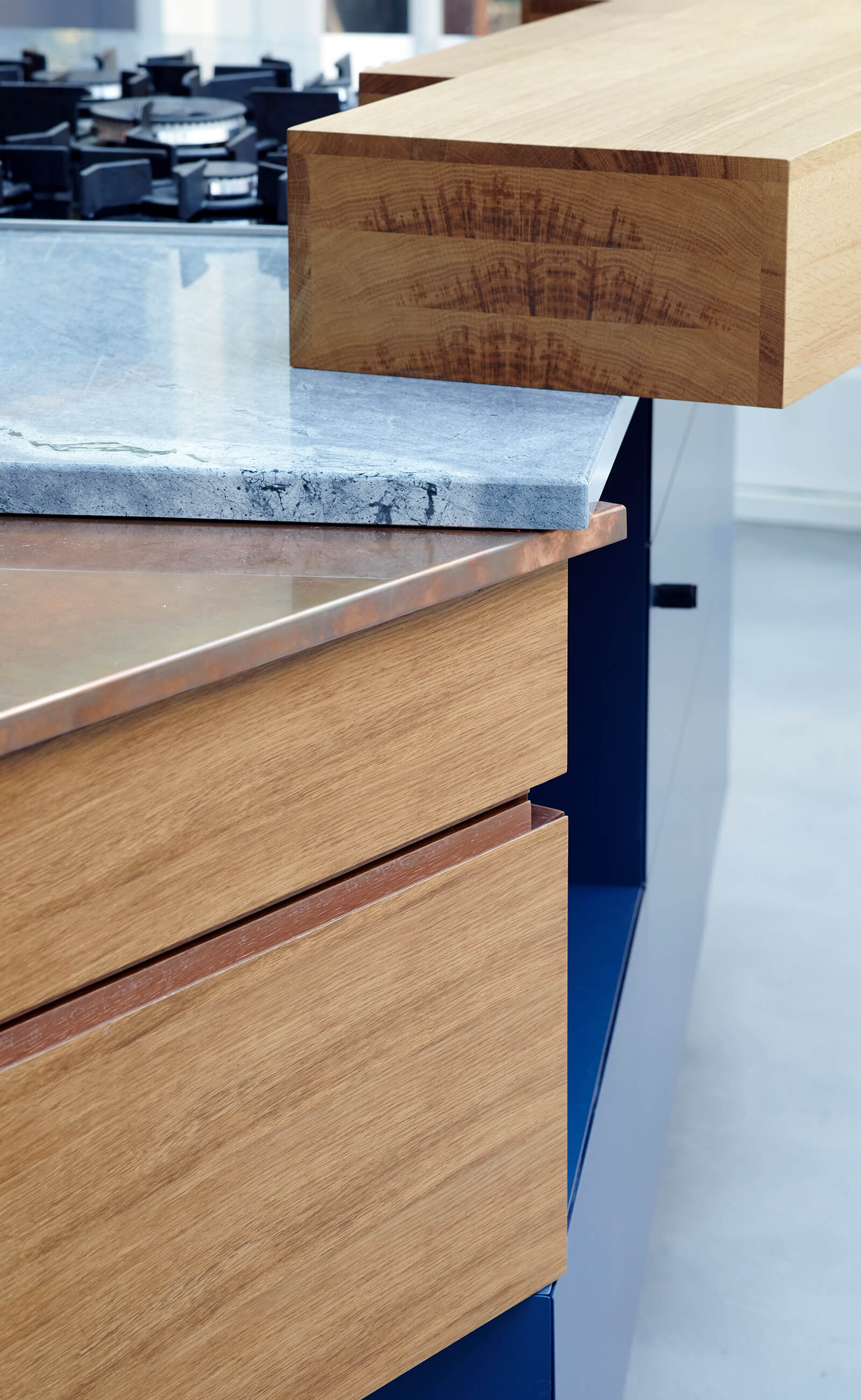 Counter top details in marble and copper with clever storage below