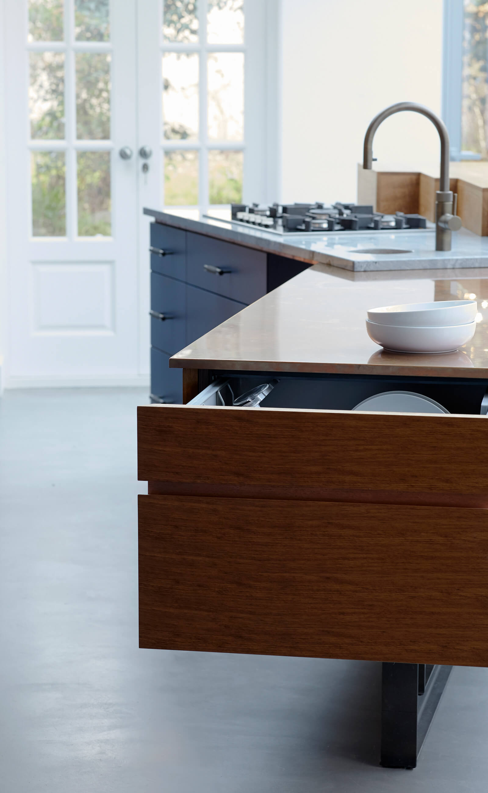 Clever dishwasher drawer storage in fun family kitchen