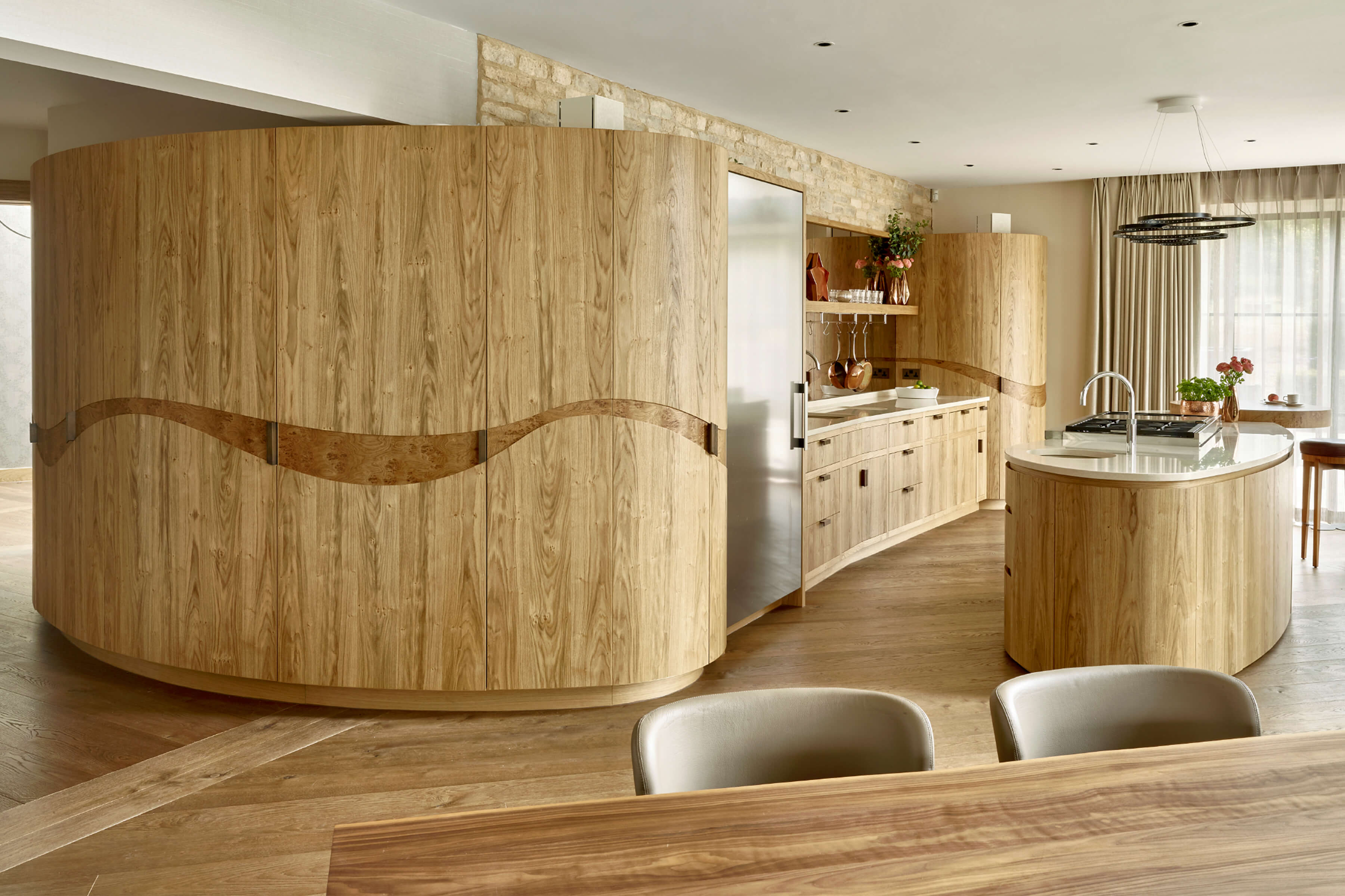 contemporary oak kitchen with organic shaped kitchen island