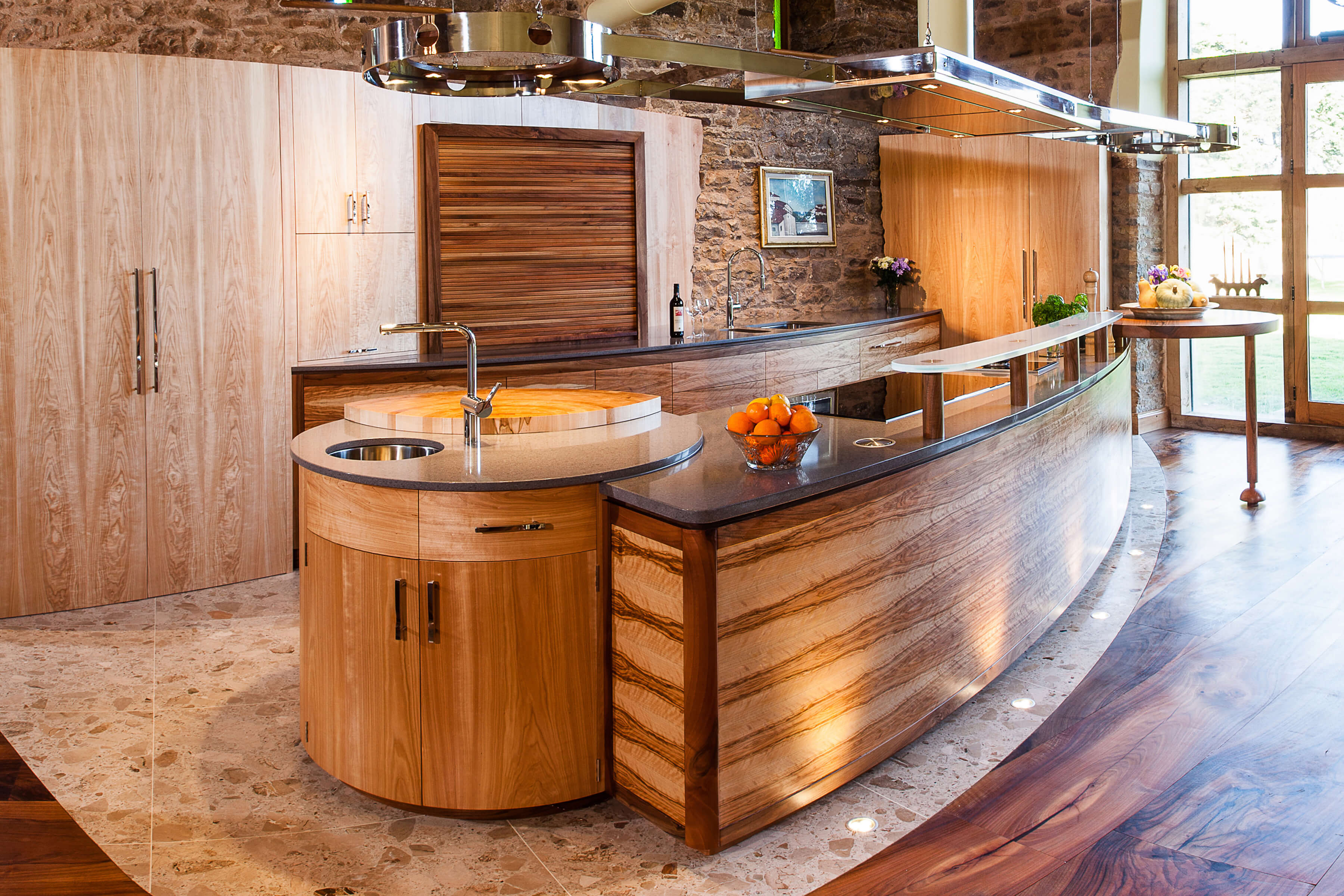 Curved kitchen design for barn restoration by Splinterworks