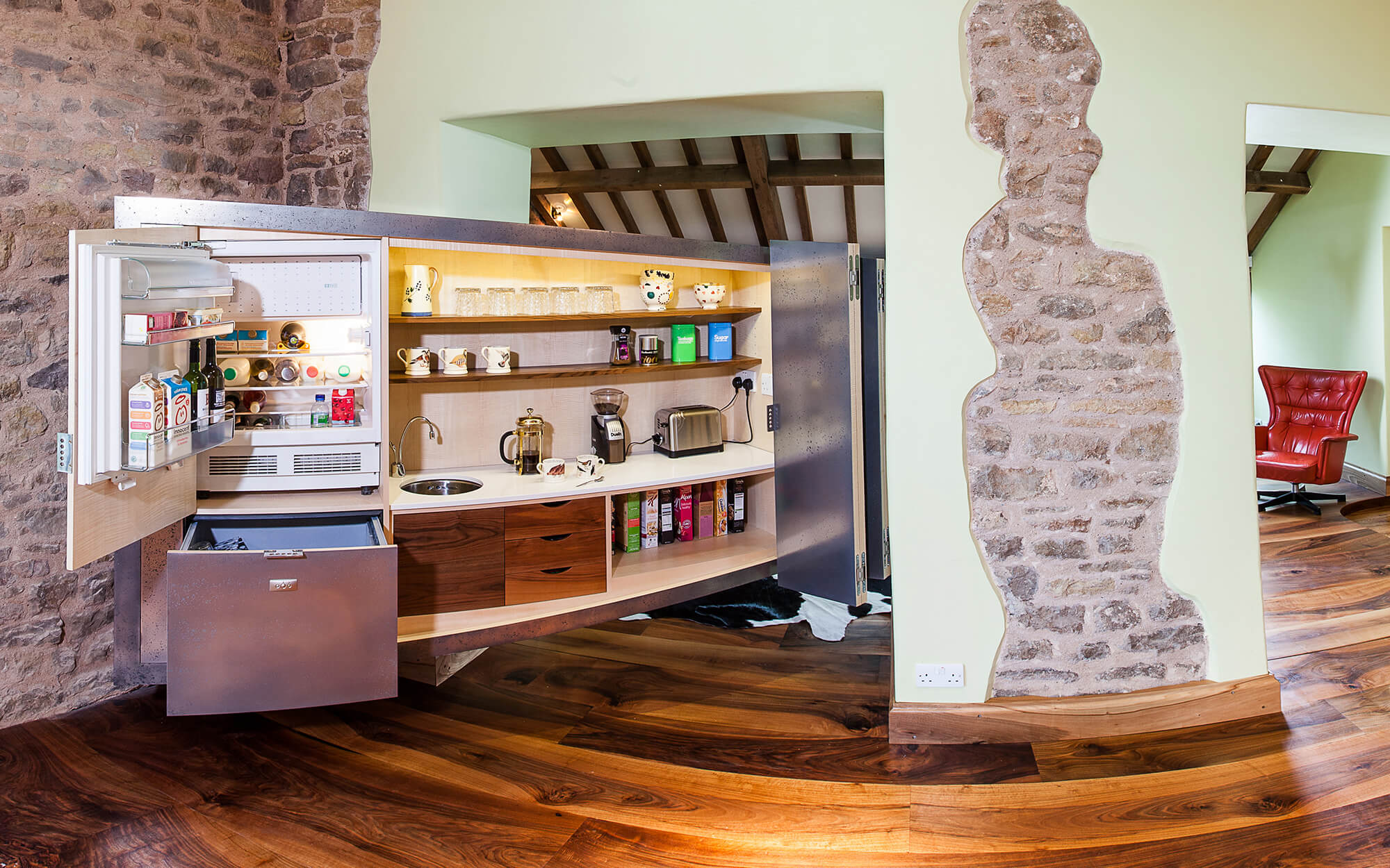 Floating cabinet made in pewter showing clever discreet storage