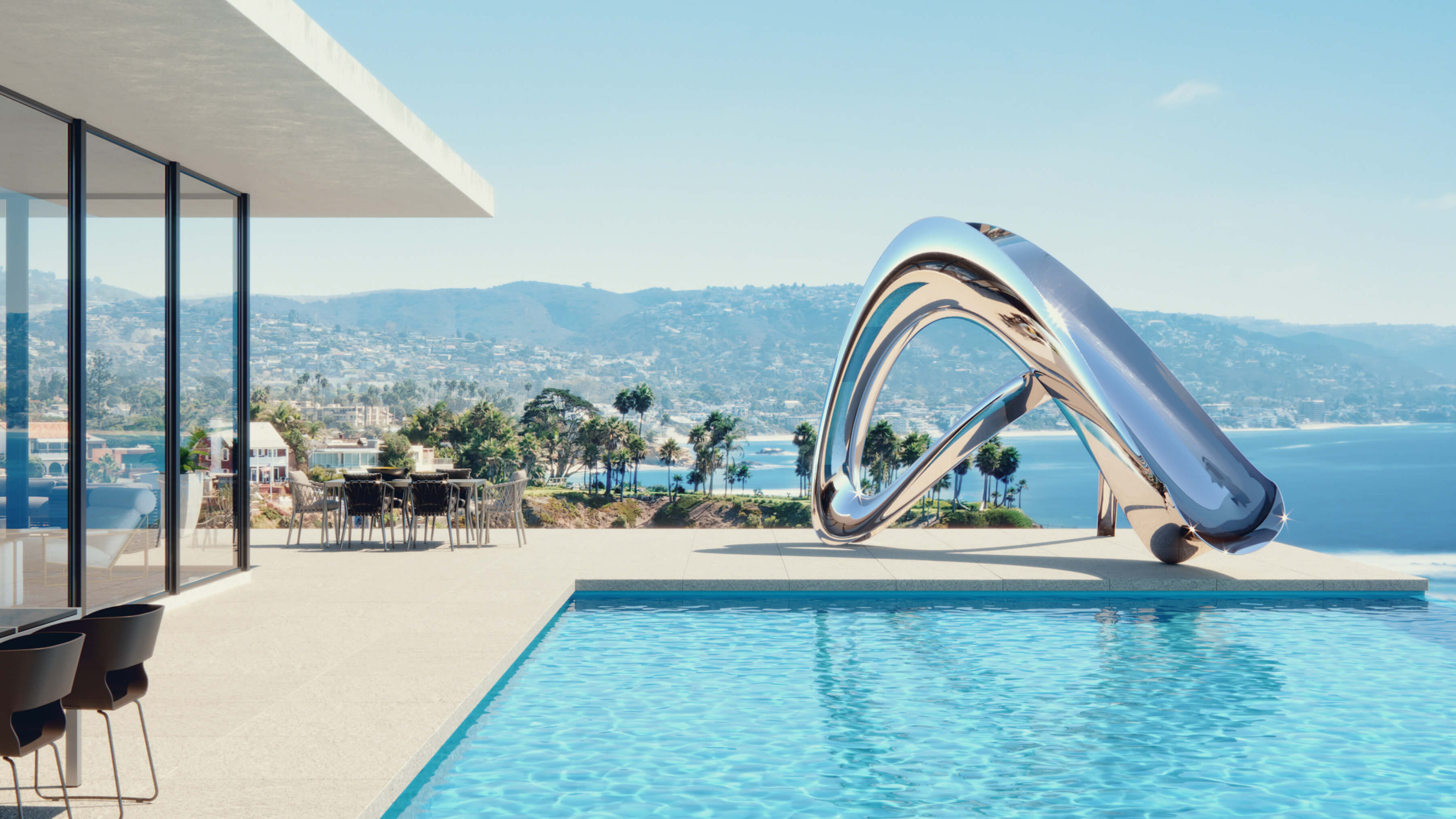 Sculptural stainless steel pool slide overlooking Los Anglese