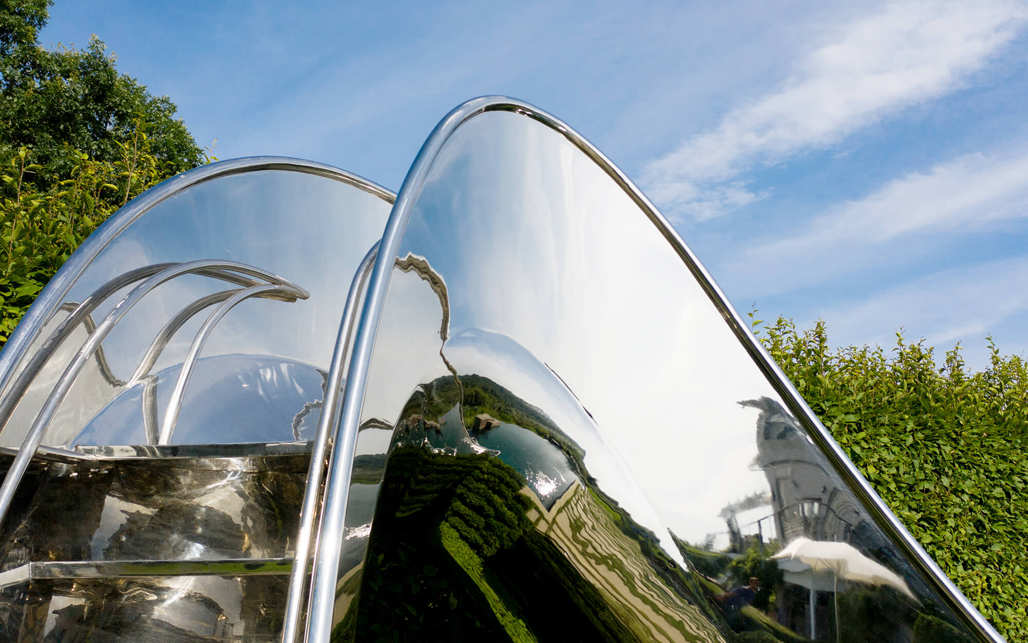 Hand rails and steps on family swimming pool slide.