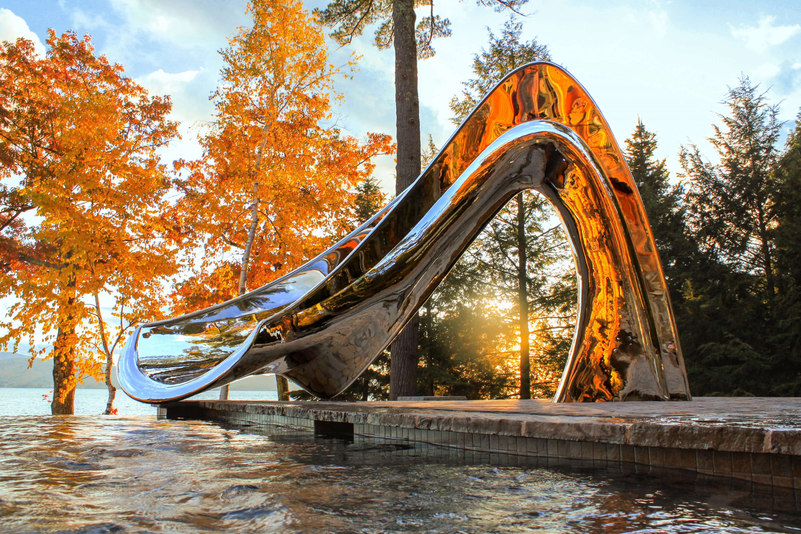 Vertex pool slide beside a lake in the fall