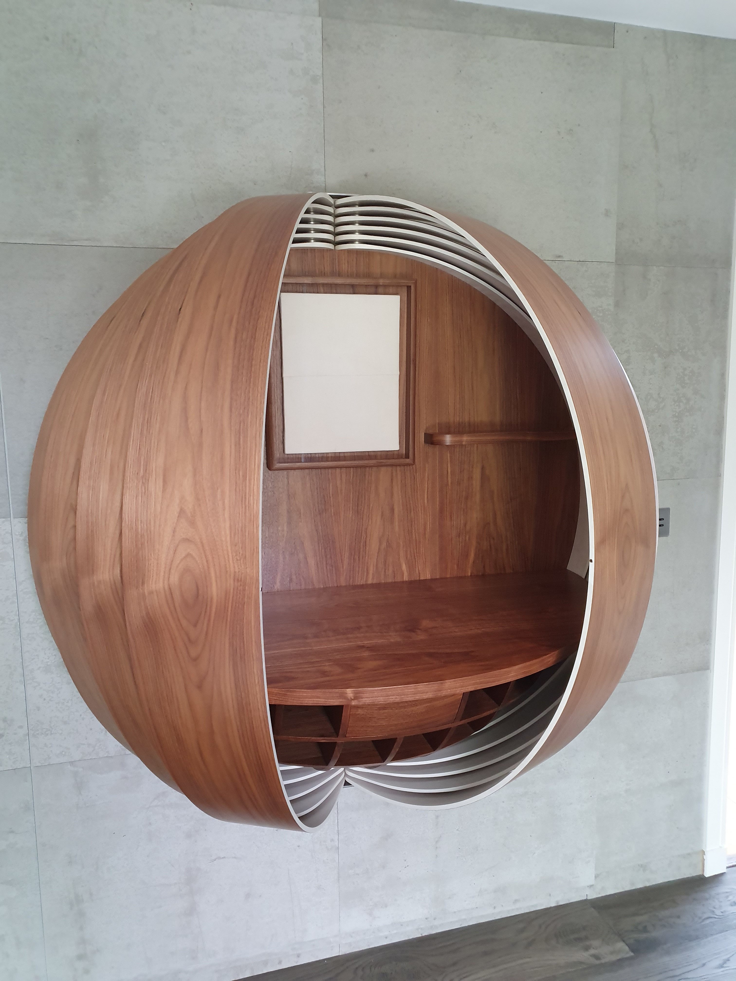 Bespoke wall-mounted desk in walnut by Splinterworks.