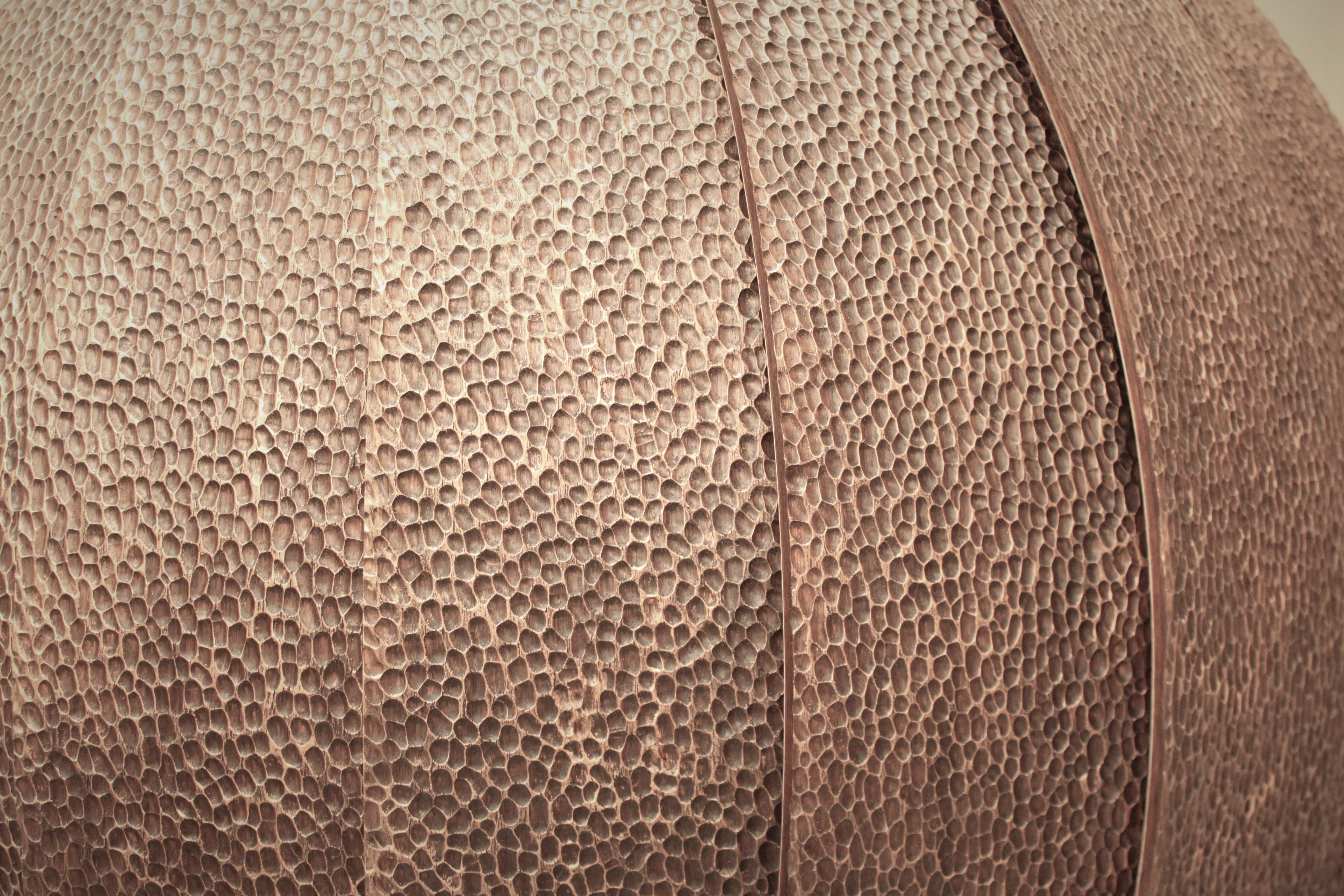 Detail of tooled walnut veneer on custom wall-mounted desk by Splinterworks.