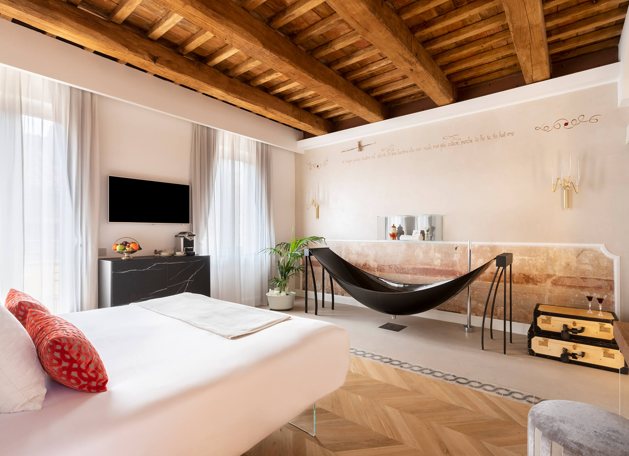 Black hammock bath by Splinterworks in hotel bedroom, in Rome.