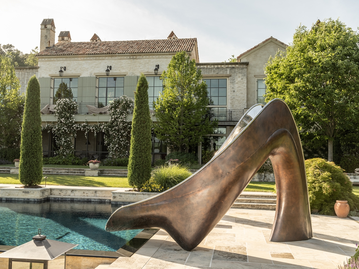 Bronze Vertex water slide in front of french style country house
