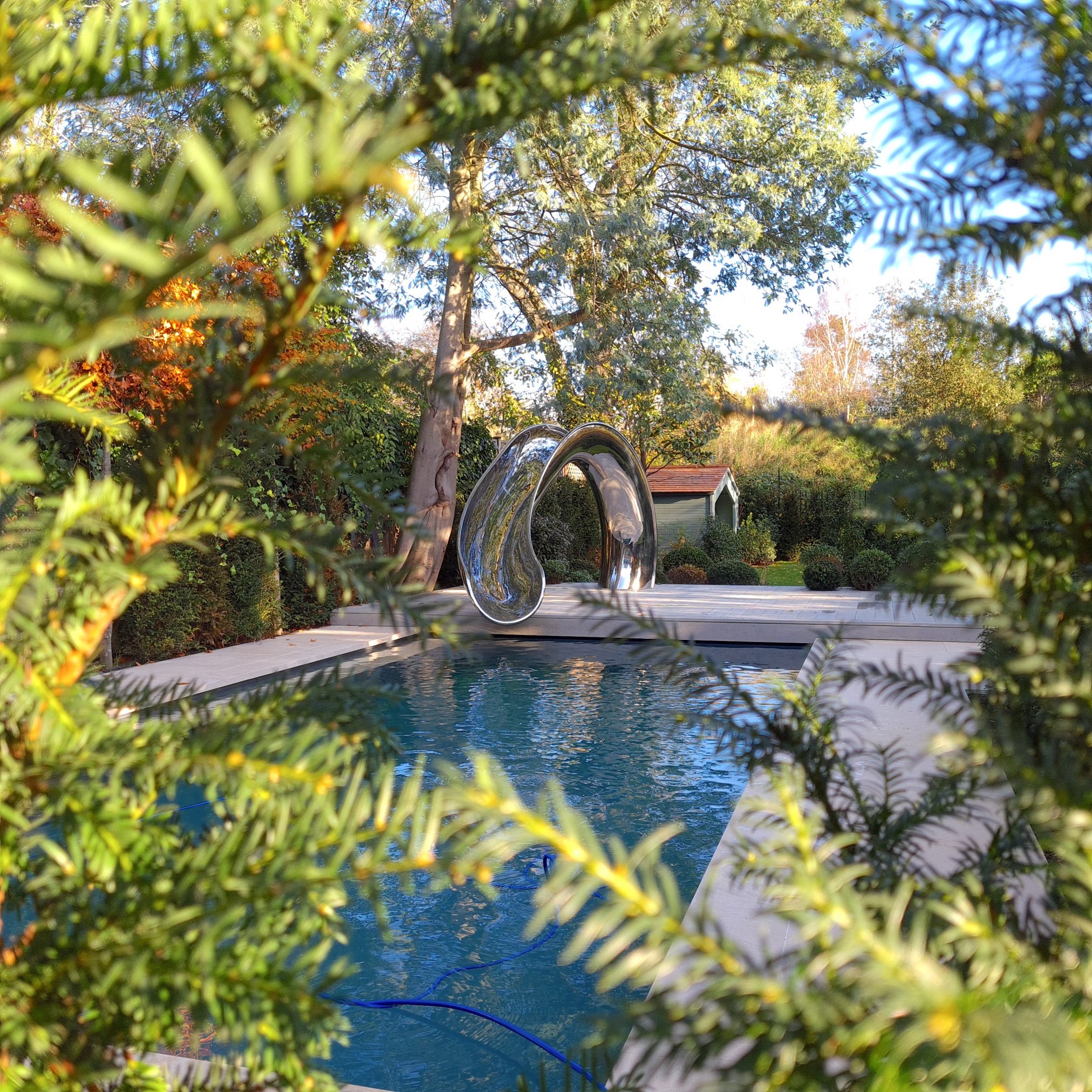 Water slide surrounded by trees