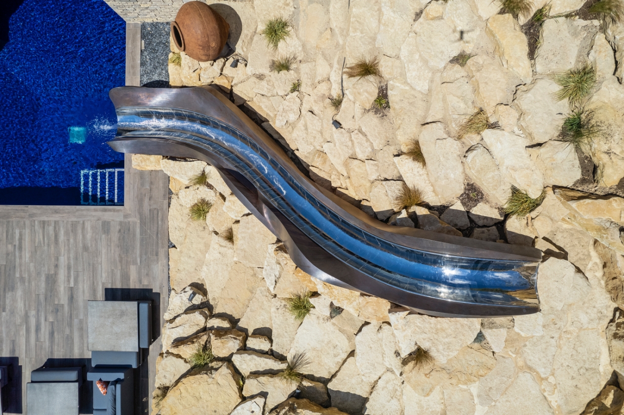 Birds eye view of rockery garden with cascade slide snaking through