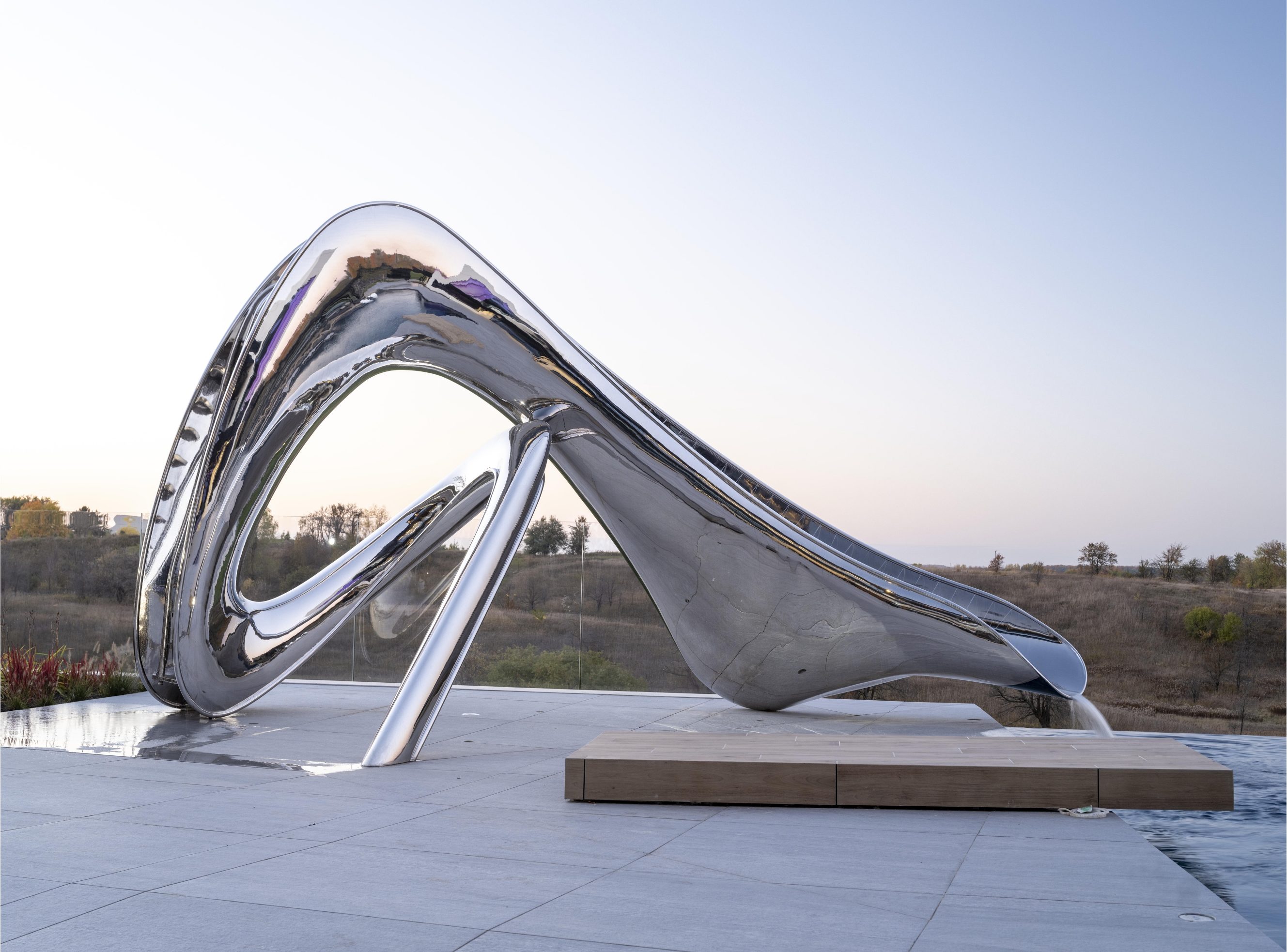 Side image of the tryst pool slide by Splinterworks, with countryside in the background