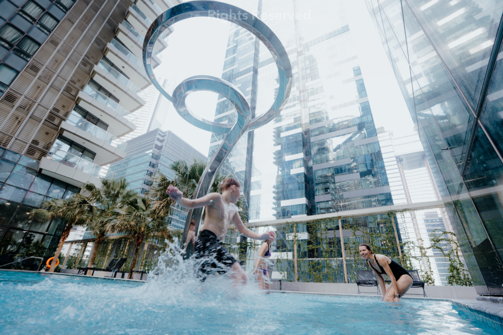 Child-friendly stainless steel water feature sculpture with custom controllable water spouts